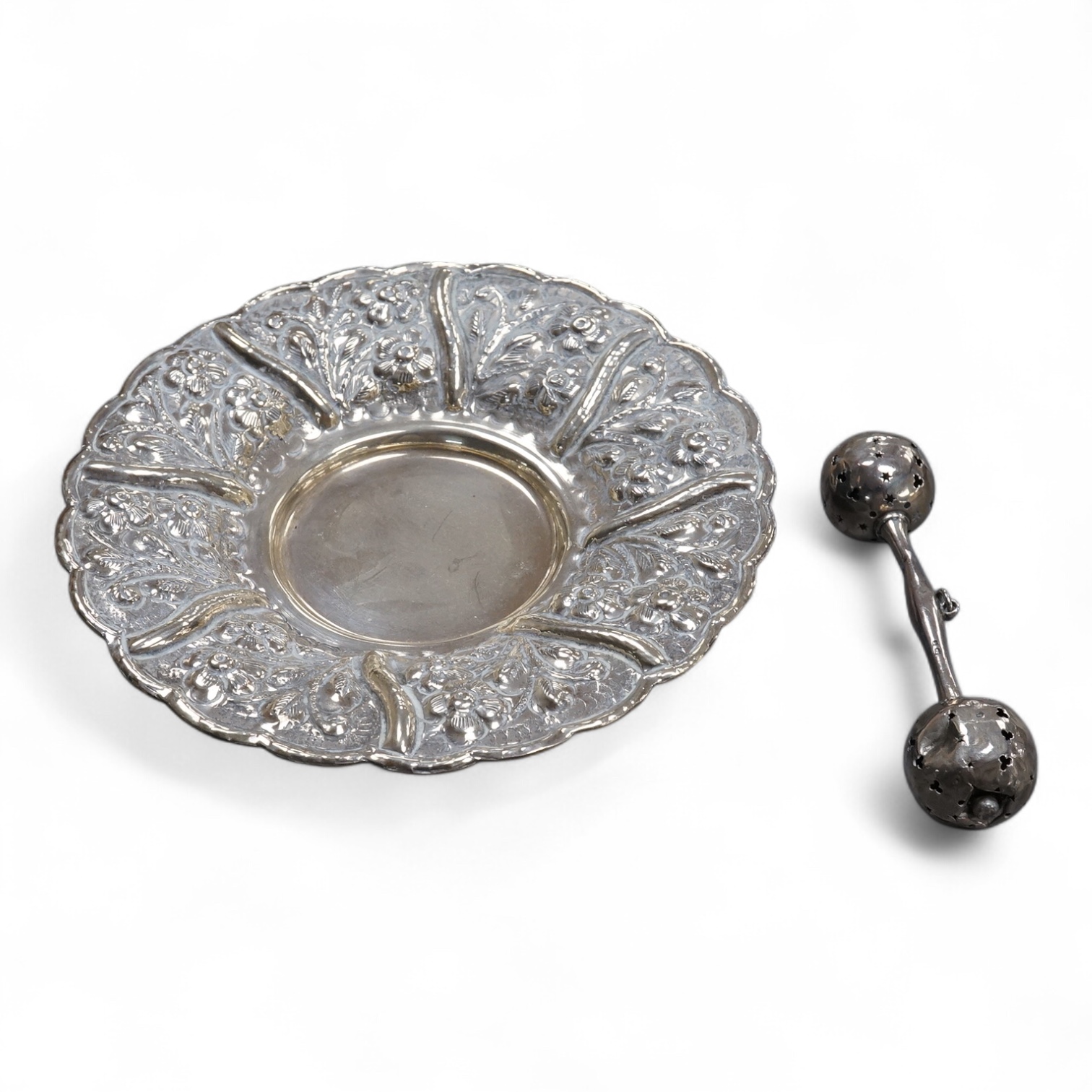 An Edwardian silver child's rattles, of dumbbell form, Crisford & Norris, Birmingham, 1906, 11cm, together with a 20th century Egyptian 900 standard white metal dish, post 1946 mark,(lead solder).